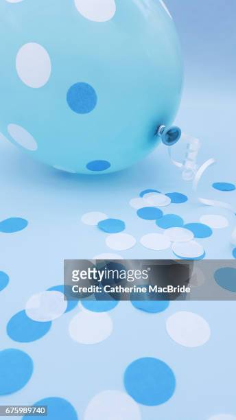 blue balloon and confetti - catherine macbride stock pictures, royalty-free photos & images