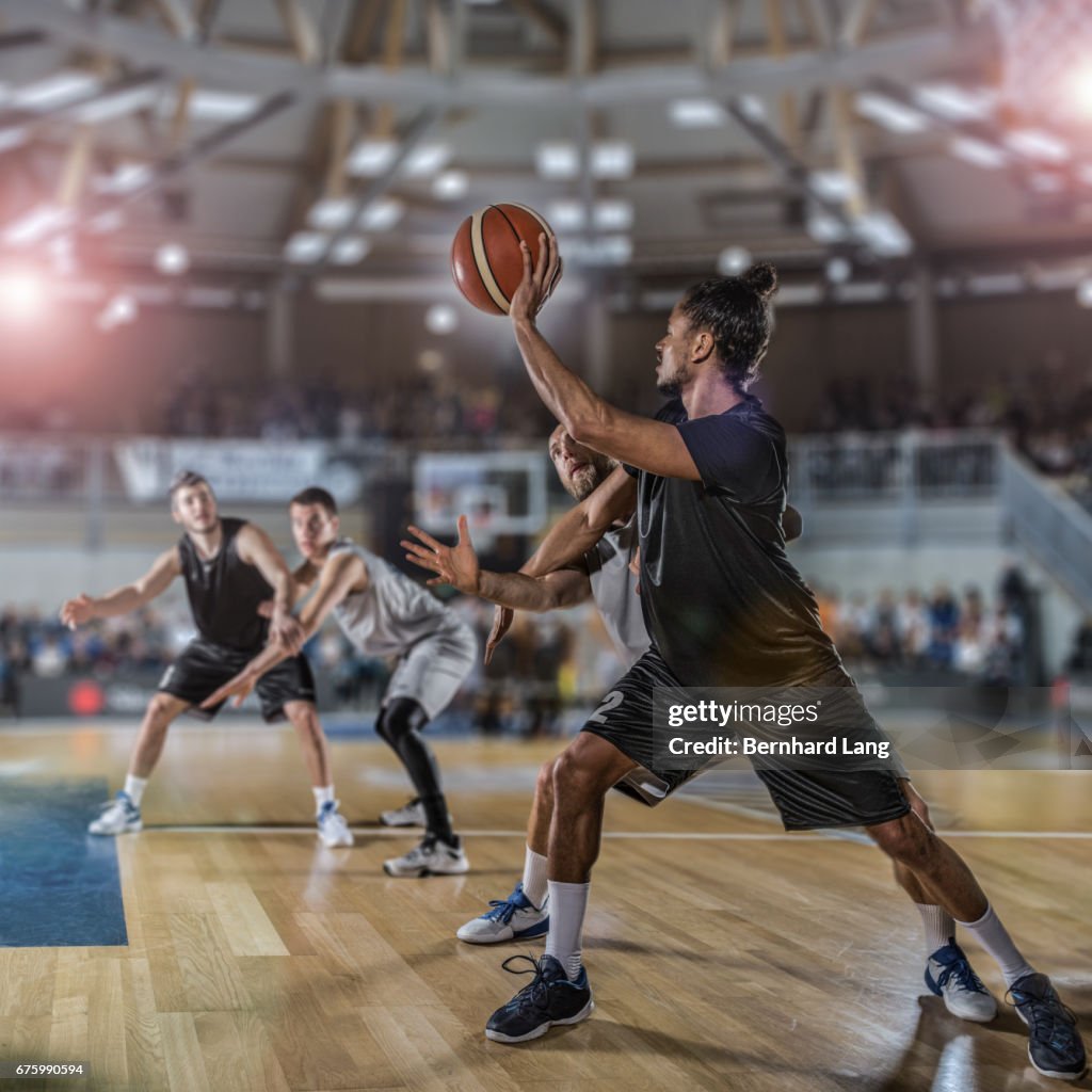 Basketball player trying to pass ball