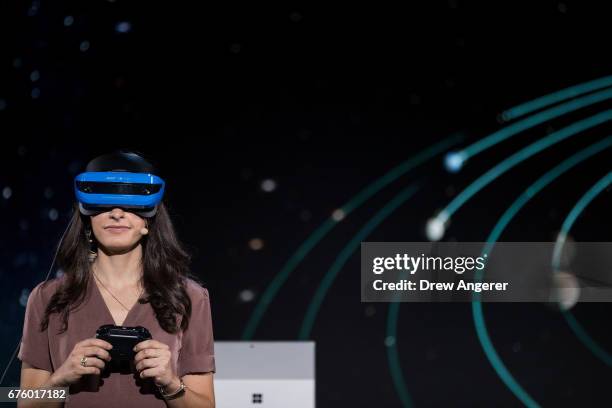 Microsoft employee demonstrates a Acer Windows VR headset during a Microsoft launch event, May 2, 2017 in New York City. The Windows 10 S operating...