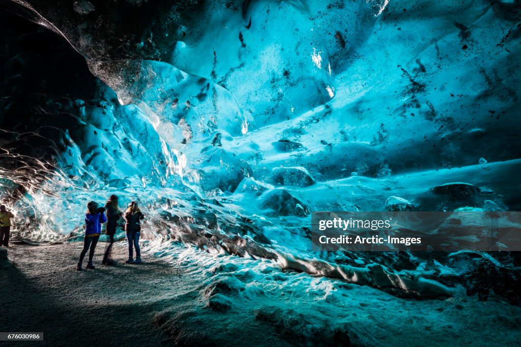 Tourists in The Crystal Cave, Breidamerkurjokull Glacier, Iceland