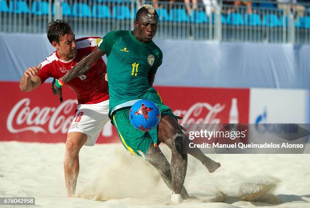 Moritz Jaeggy of Switzerland competes for the ball with Ibrahima Balde of Senegal during the FIFA Beach Soccer World Cup Bahamas 2017 group A match...