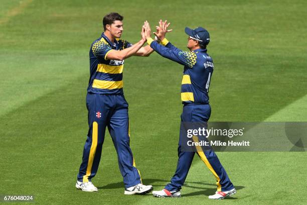 Marchant de Lange ofGlamorgan celebrates with Jacques Rudolph after they combined to dismiss Stiaan van Zyl of Sussex during the Royal London One-Day...