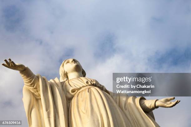 blessed virgin mary and sky background. - san cristóbal hill chile stock pictures, royalty-free photos & images