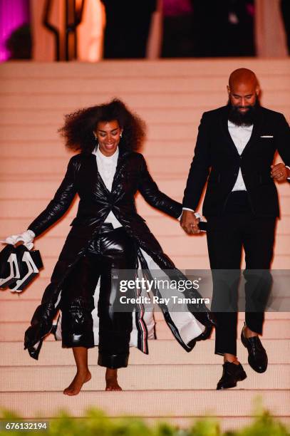 Singer Solange Knowles and director Alan Ferguson leave the Rei Kawakubo/Comme des Garcons: Art Of The In-Between" Costume Institute Gala at the...