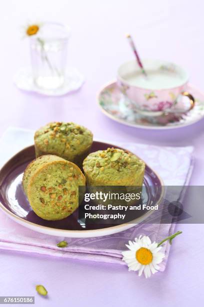 pistachio muffins - dessert topping stock pictures, royalty-free photos & images