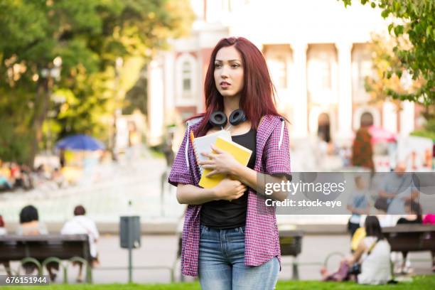 portrait of a student holding coursework - coursework stock pictures, royalty-free photos & images