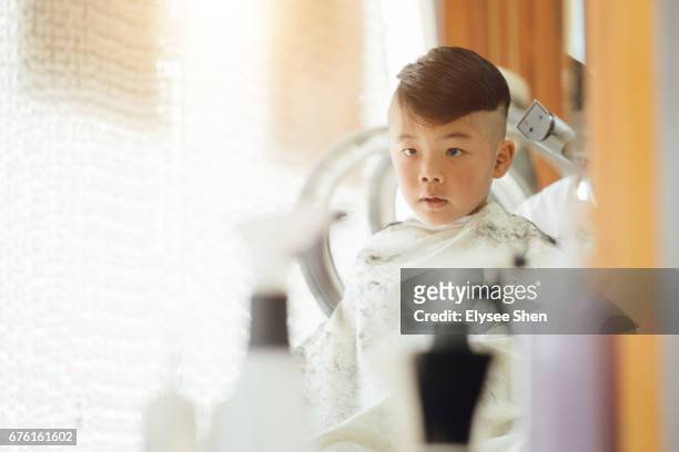 a chinese baby boy cutting hair at quirky moments - half shaved hair stock pictures, royalty-free photos & images