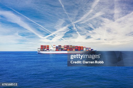 Cargo ship transporting containers across the sea Cargo ship transporting containers across the sea