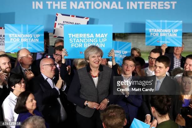 Britain's Prime Minister Theresa May smiles as she addresses an audience of supporters during a campaign stop on May 2, 2017 in Bristol, England. The...