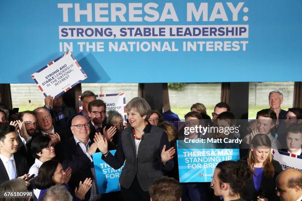 Britain's Prime Minister Theresa May reacts as she addresses an audience of supporters during a campaign stop on May 2, 2017 in Bristol, England. The...