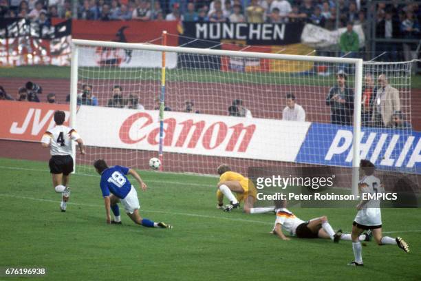 Italy's Roberto Mancini scores the opening goal of the game past West Germany goalkeeper Eike Immel