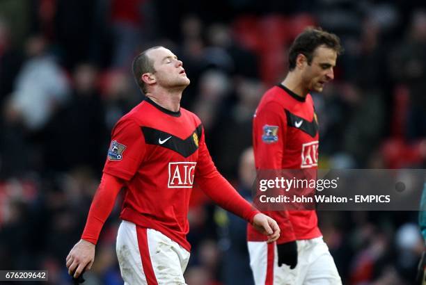 Manchester United's Wayne Rooney and Dimitar Berbatov walk off dejected after the final whistle