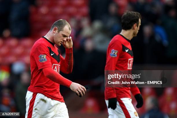 Macnhester United's Wayne Rooney Dimitar Berbatov stand dejected after the final whistle