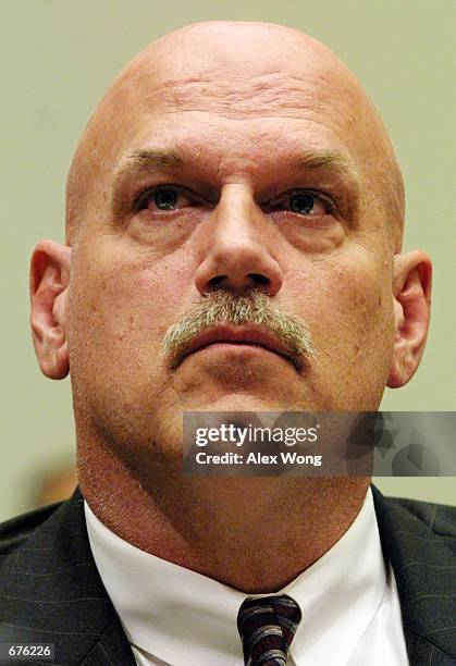 Minnesota Governor Jesse Ventura listens to opening statements during a hearing on H.R. 3288, the "Fairness in Antitrust in National Sports Act of...