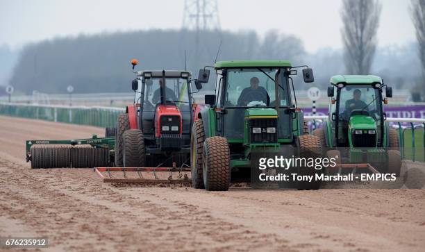 Tractors smooth out the track prior to the next race