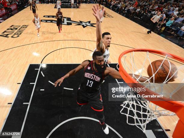 James Harden of the Houston Rockets drives to the basket against Danny Green of the San Antonio Spurs during Game One of the Western Conference...