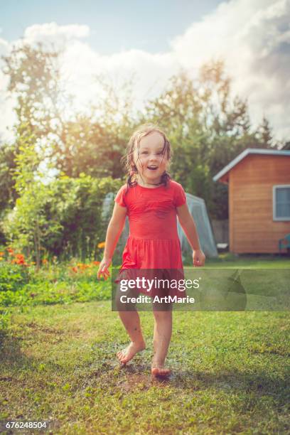 happy girl playing outdoors in summer - hot dirty girl stock pictures, royalty-free photos & images