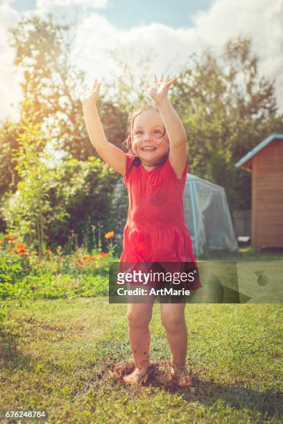 happy girl playing outdoors in summer - hot dirty girl stock pictures, royalty-free photos & images