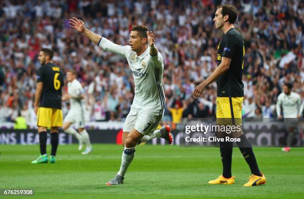 Cristiano Ronaldo of Real Madrid celebrates as he scores their first goal during the UEFA Champions League semi final first leg match between Real...