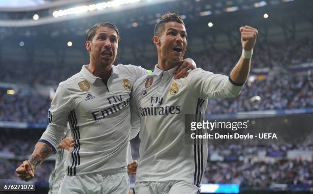 Cristiano Ronaldo of Real Madrid CF celebrates with Sergio Ramos after scoring his team's opening goal in the UEFA Champions League Semi Final first...
