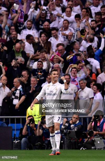 Real Madrid's Portuguese forward Cristiano Ronaldo celebrates a goal during the UEFA Champions League semifinal first leg football match Real Madrid...