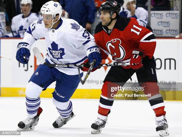 Stephen Gionta of the New Jersey Devils plays in the game against the Sam Carrick Toronto Maple Leafs at the Prudential Center on April 9, 2016 in...