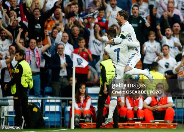 Real Madrid's Portuguese forward Cristiano Ronaldo celebrates a goal with Real Madrid's defender Sergio Ramos during the UEFA Champions League...