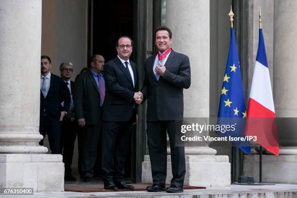 French President Francois Hollande decorated Former Governor of California and current Founding President of Regions of Climate Action Arnold...