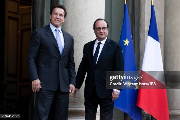 French President Francois Hollande receives Former Governor of California and current Founding President of Regions of Climate Action Arnold...