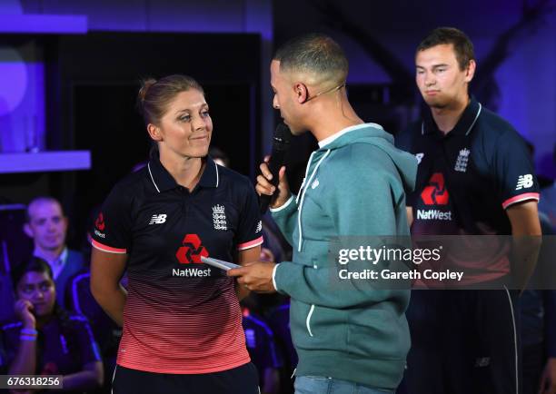 Heather Knight, England Women's captain talks with TV presenter and Radio DJ Marvin Humes during the New Balance England Cricket Kit Launch at the...