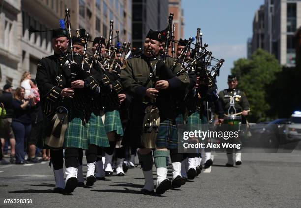 Members of the Montgomery County Police Pipe's and Drums Band from Maryland leads a procession for the 23rd annual Blue Mass in recognition of first...