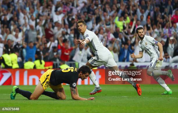 Cristiano Ronaldo of Real Madrid celebrates as he scores their second goal during the UEFA Champions League semi final first leg match between Real...