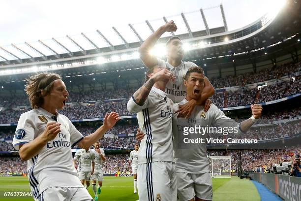 Cristiano Ronaldo of Real Madrid celebrates with teammates Luka Modric , Sergio Ramos and Casemiro after scoring the opening goal during the UEFA...