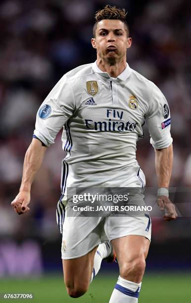Real Madrid's Portuguese forward Cristiano Ronaldo runs for the ball during the UEFA Champions League semifinal first leg football match Real Madrid...