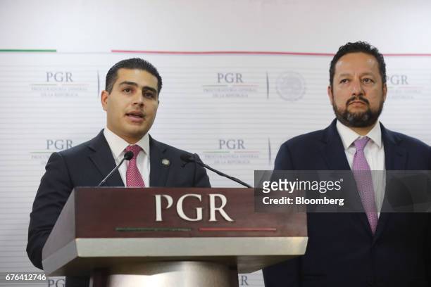 Omar Hamid Garcia Harfuch, director of the criminal investigation agency , left, speaks while Alonso Israel Lira Salas, director of the assistant...