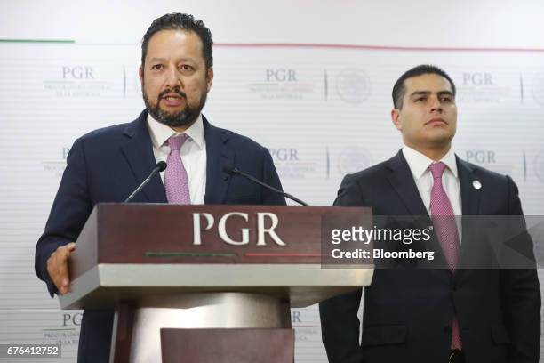 Alonso Israel Lira Salas, director of the assistant attorney general's office for special investigations on organized crime , left, speaks while Omar...