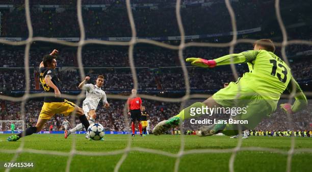 Cristiano Ronaldo of Real Madrid scores their third goal past goalkeeper Jan Oblak of Atletico Madrid during the UEFA Champions League semi final...