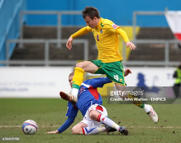 Carlisle United's Adam Clayton tackles Bristol Rovers' Chris Lines