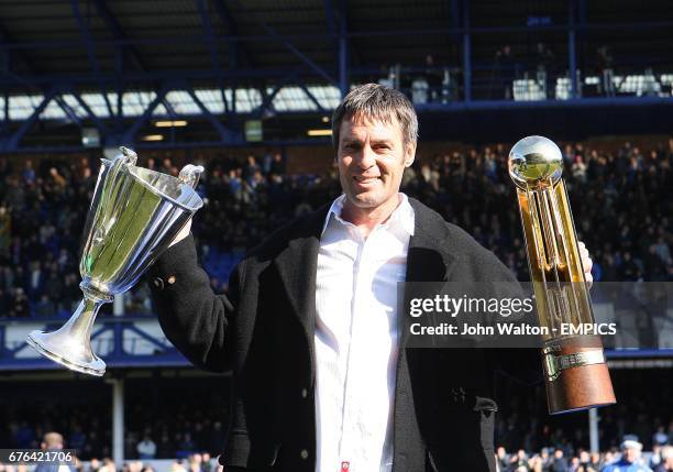 Former Everton player Pat van de Hauwe shows the crowd the European Cup Winners Cup and Canon League Trophy