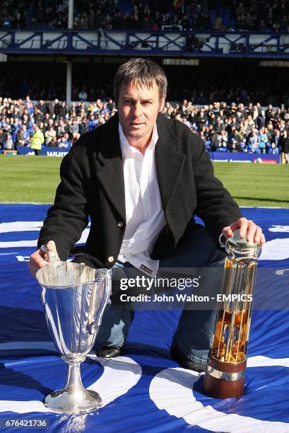 Former Everton player Pat van de Hauwe shows the crowd the European Cup Winners Cup and Canon League Trophy