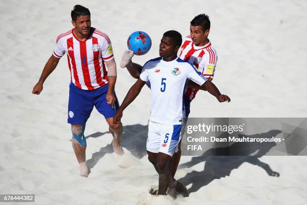 Alfonso Maquensi of Panama battles for the ball with Orlando Zayas and Luis Ojeda of Paraguay during the FIFA Beach Soccer World Cup Bahamas 2017...