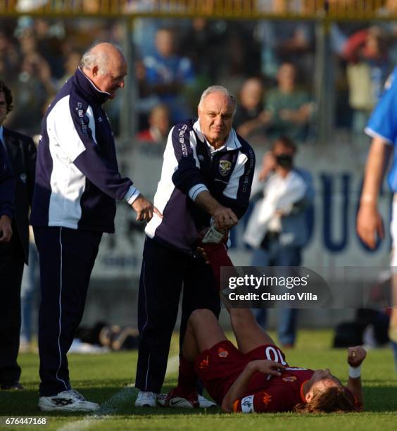 Mazzone of Brescia speak with the injured Francesco Totti of Roma during the Serie A 4th round league match played between BRESCIA and ROMA at the M....