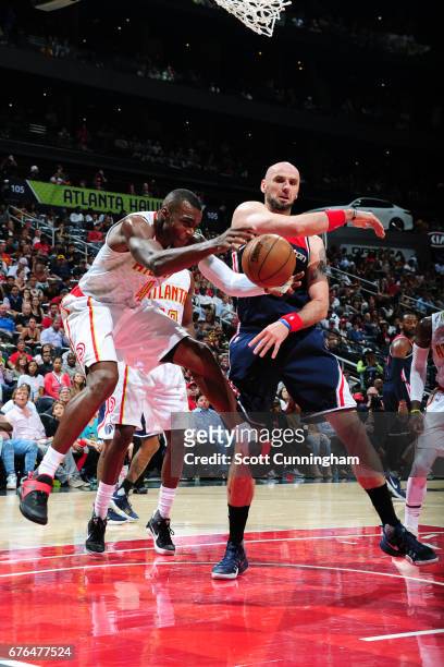Paul Millsap of the Atlanta Hawks goes for a loose ball during the game against Marcin Gortat of the Washington Wizards during Game Six of the...