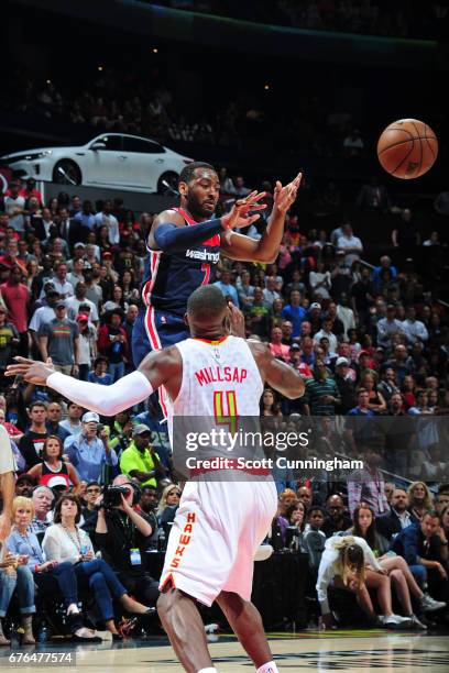 John Wall of the Washington Wizards passes the ball during the game against the Atlanta Hawks during Game Six of the Eastern Conference Quarterfinals...