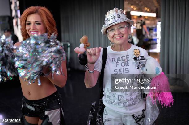 Fan poses for a picture before the game between the San Antonio Spurs and the Houston Rockets during Game One of the Western Conference Semifinals of...