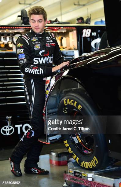 Noah Gragson, driver of the Kyle Busch Motosports Toyota, stands in the garage area during the NASCAR Camping World Truck Series test session at...