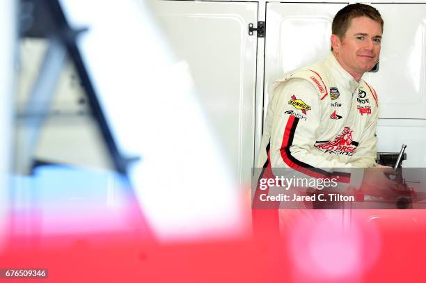 Timothy Peters, driver of the Red Horse Racing Toyota, looks on during the NASCAR Camping World Truck Series test session at Charlotte Motor Speedway...