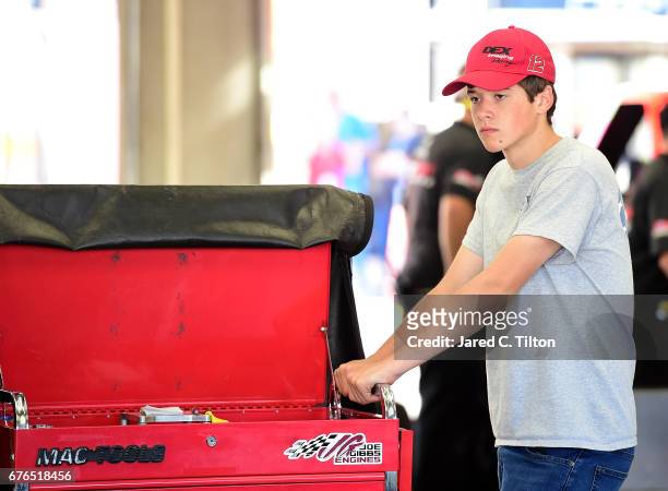 Harrison Burton stands in the garage area during the NASCAR Camping World Truck Series test session at Charlotte Motor Speedway on May 2, 2017 in...