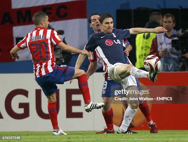 Atletico Madrid's Sabrosa Simao and Fulham's Zoltan Gera battle for the ball