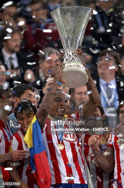 Atletico Madrid's Luis Amaranto Perea celebrates with the UEFA Europa League trophy after the game